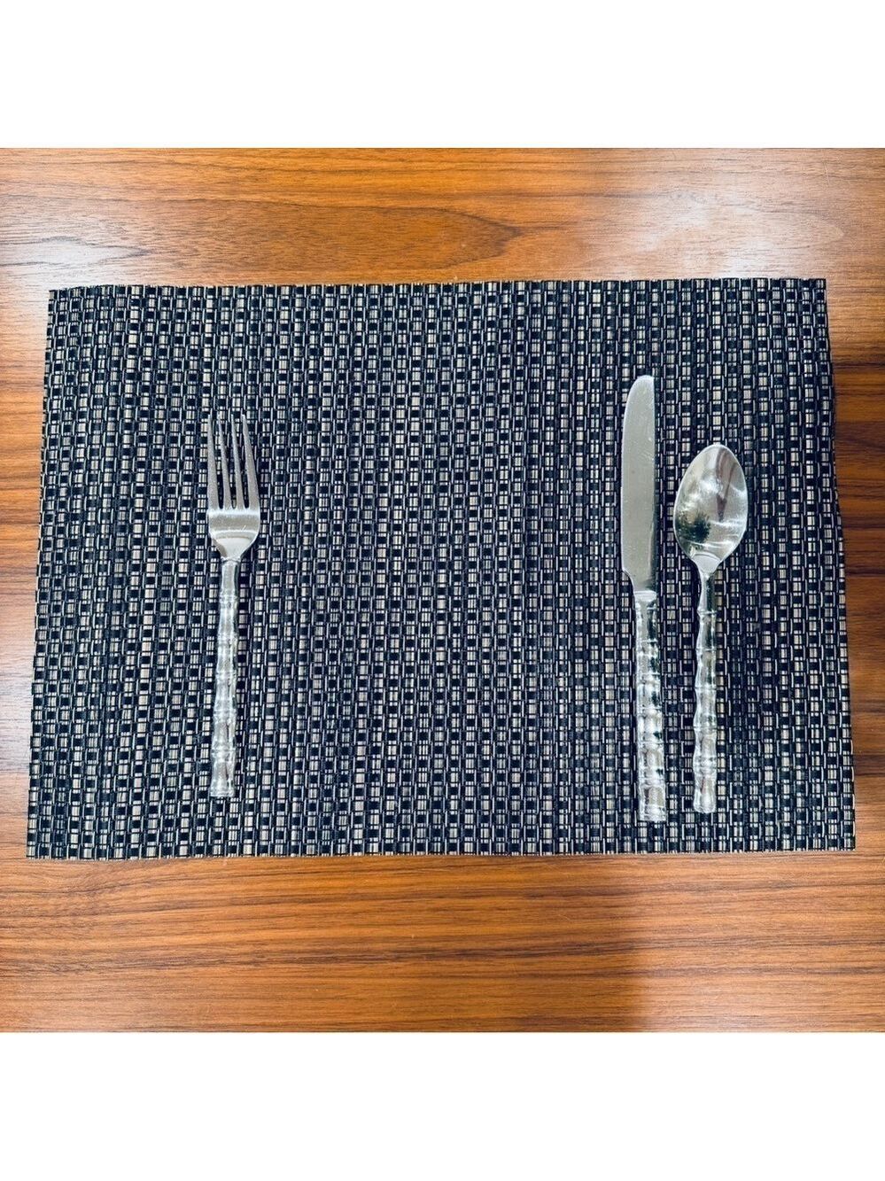 Elegant Black and Silver woven vinyl placemat set.